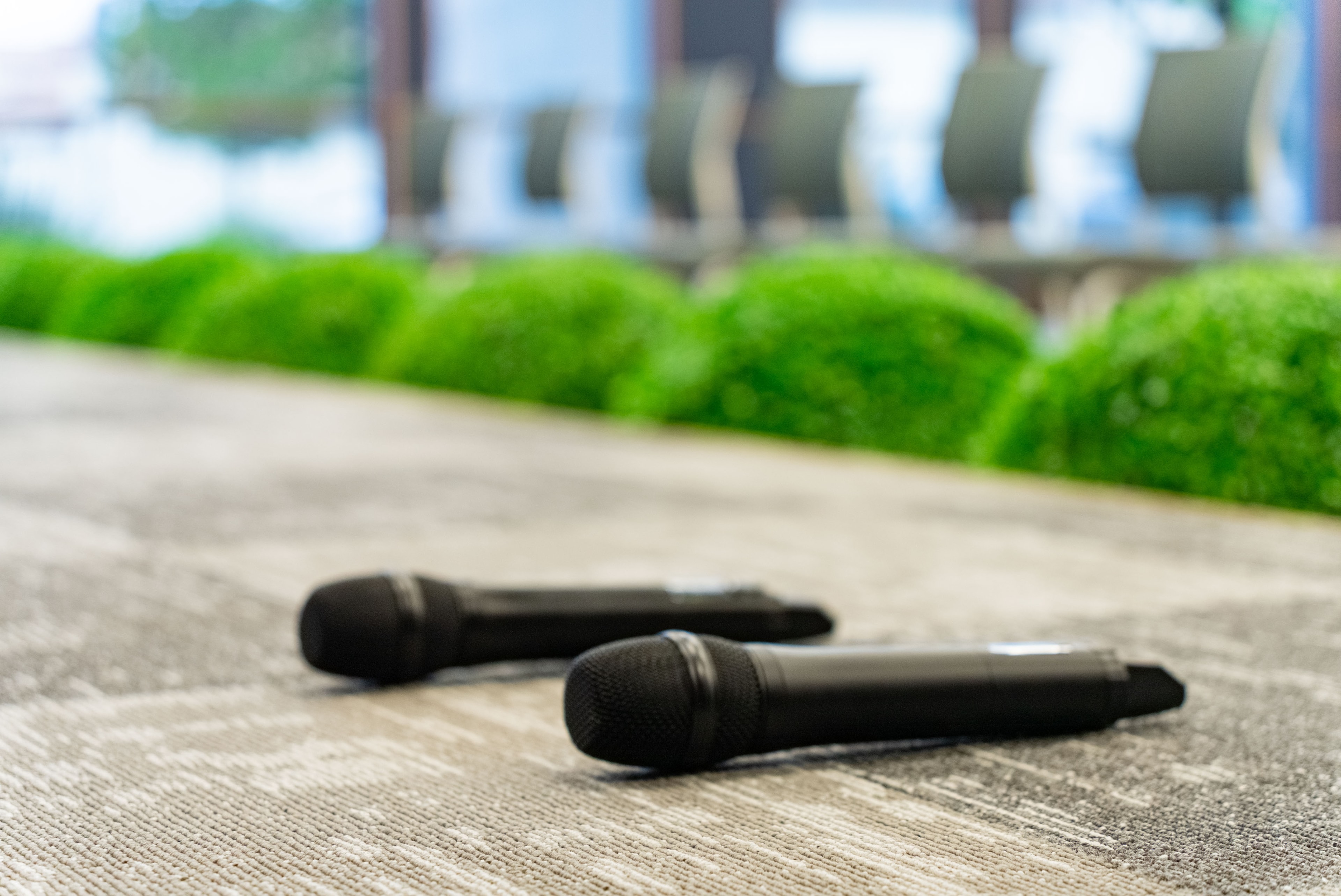 Wireless microphones resting on the stage floor