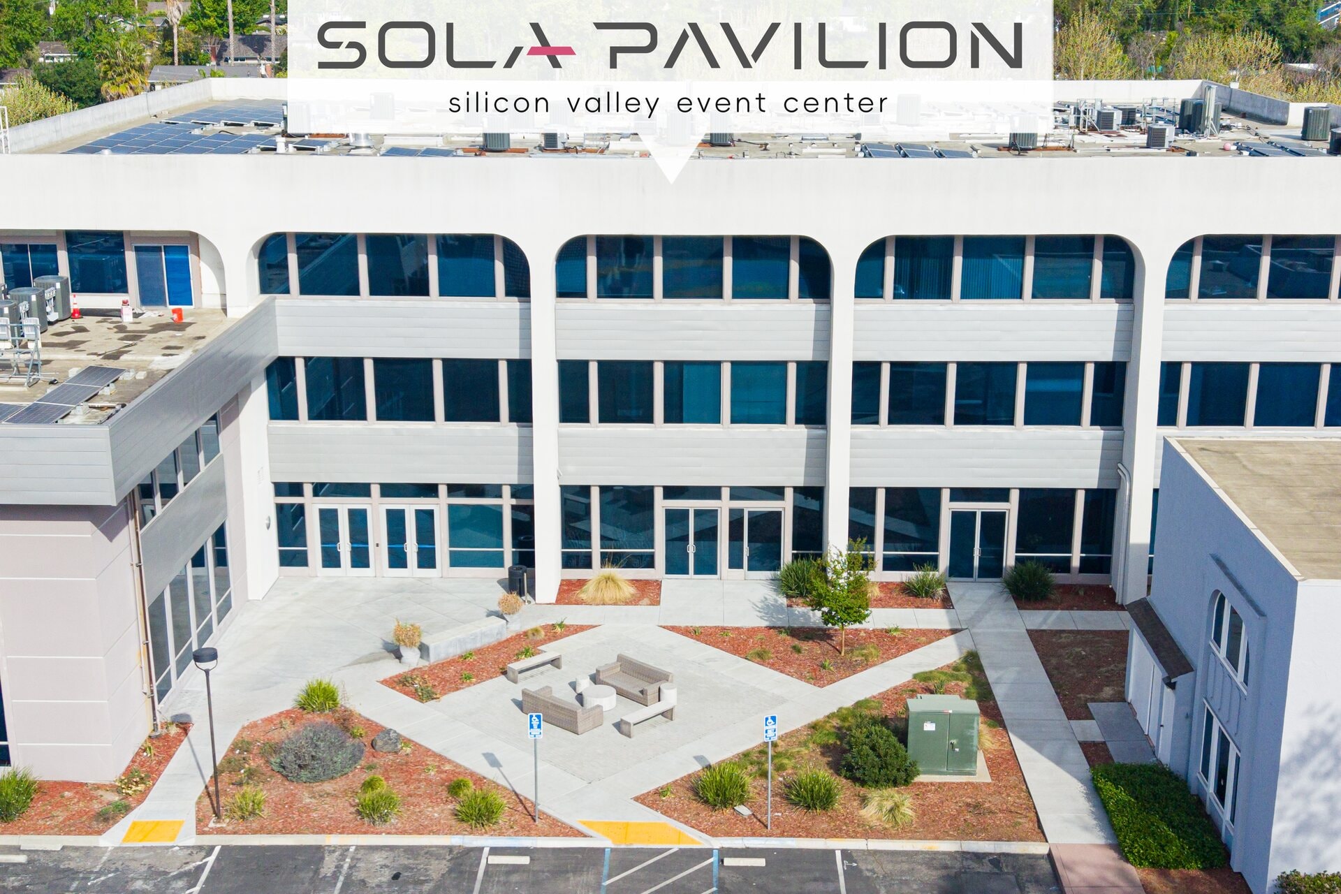 Aerial view of Sola Pavilion exterior courtyard and modern building facade