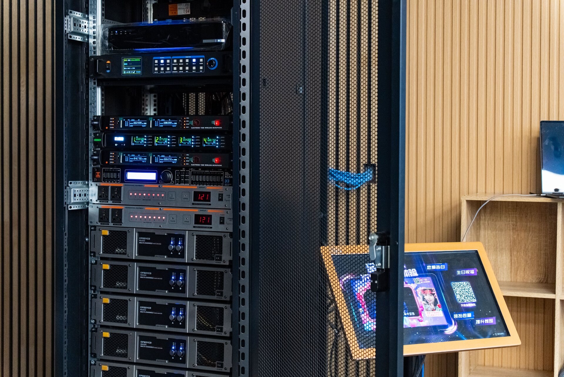 AV control rack with professional audio and video equipment